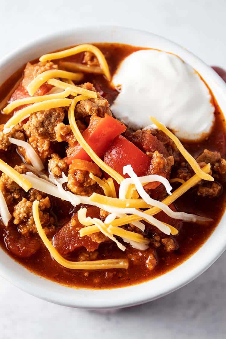 overhead view of low carb turkey chili with sour cream and cheese on top