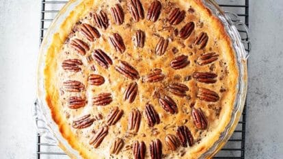 overhead view of a keto pecan pie on a cooling rack