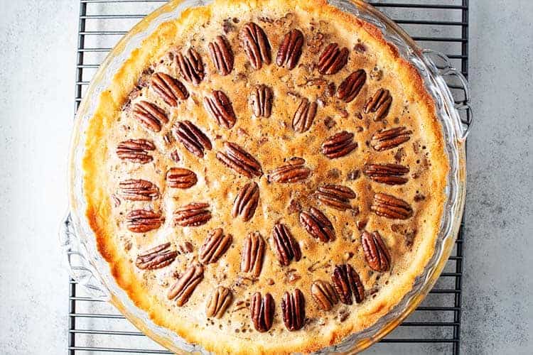 overhead view of a keto pecan pie on a cooling rack