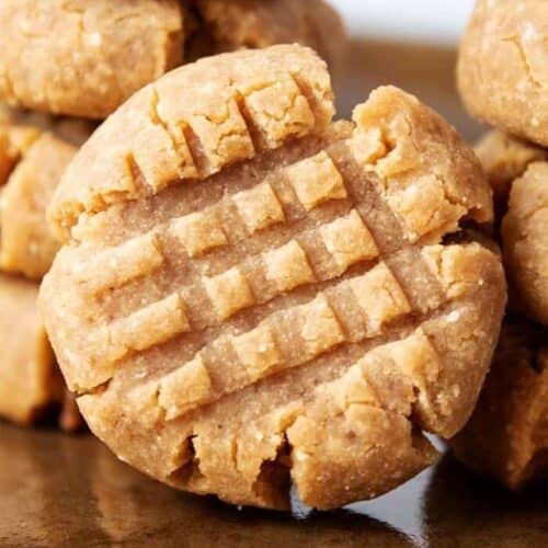stack of keto peanut butter cookies on cookie sheet