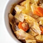 left side of keto cabbage soup in a white bowl