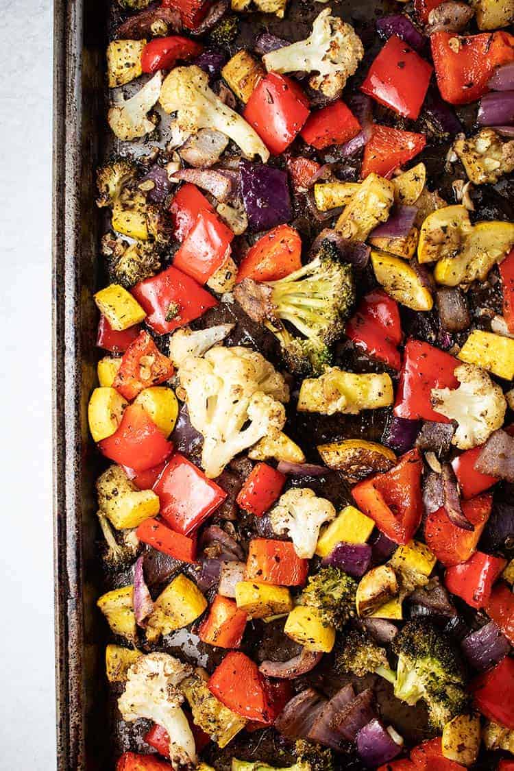 overhead view of keto roasted vegetables on large baking sheet