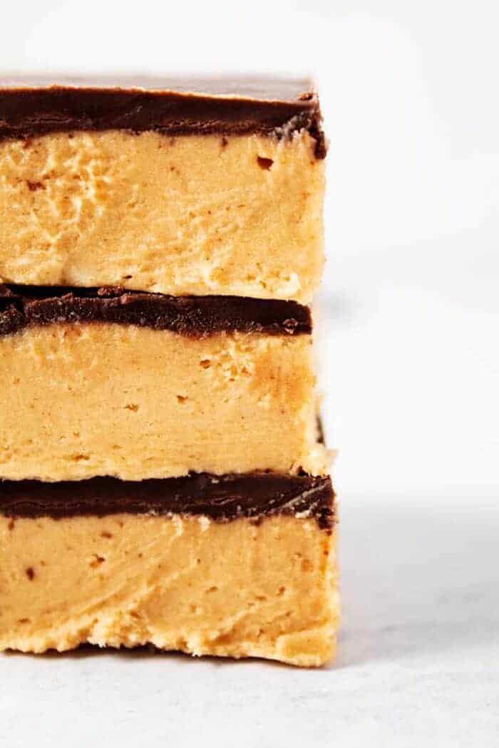 side view of three stacked keto no bake peanut butter bars