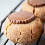sideview of keto gluten free sugar free reeses peanut butter cup cookies on wire cooling rack