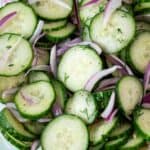 overhead view of cucumber salad with onions ready to serve
