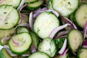 overhead view of cucumber salad with onions ready to serve