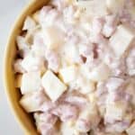 overhead view of ham salad ready to serve in a yellow bowl