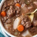 overhead view of keto ground beef stew in a white serving bowl ready to serve